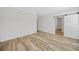 Spacious bedroom with wood-look floors and barn door at 19095 Willard Ave, Port Charlotte, FL 33954