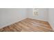 Spacious bedroom with wood-look floors and a large window at 19095 Willard Ave, Port Charlotte, FL 33954