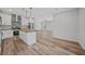 Modern kitchen with white cabinets, wood countertops, and stainless steel appliances at 19095 Willard Ave, Port Charlotte, FL 33954