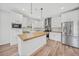 Modern kitchen with white cabinets and wood countertops at 19095 Willard Ave, Port Charlotte, FL 33954