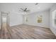 Spacious living area with wood-look floors and shiplap accent wall at 19095 Willard Ave, Port Charlotte, FL 33954