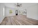 Open concept living area with kitchen and wood-look floors at 19095 Willard Ave, Port Charlotte, FL 33954