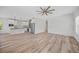 Open living room and kitchen with wood-look floors at 19095 Willard Ave, Port Charlotte, FL 33954