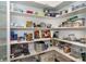 Well-organized pantry with ample shelving for storage at 195 W Pine Valley Ln, Rotonda West, FL 33947