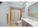 Bathroom with a toilet, vanity, and shower/tub combo at 22501 Bolanos Ct, Port Charlotte, FL 33952