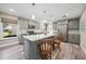 Gray kitchen with granite countertops, stainless steel appliances, and an island at 22501 Bolanos Ct, Port Charlotte, FL 33952