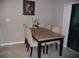 Small dining area with a granite topped table and four chairs at 22507 Provance Ave, Port Charlotte, FL 33954