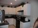 Modern kitchen with stainless steel appliances and an island at 22507 Provance Ave, Port Charlotte, FL 33954