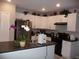 Modern kitchen with stainless steel appliances and an island at 22507 Provance Ave, Port Charlotte, FL 33954