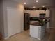 Modern kitchen with stainless steel appliances and an island at 22507 Provance Ave, Port Charlotte, FL 33954