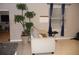 Living room with beige couch and large potted plant at 22507 Provance Ave, Port Charlotte, FL 33954