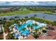 Community pool with expansive sundeck and golf course view at 23536 Awabuki Dr # 4B, Venice, FL 34293