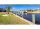 Waterfront property has a functional boat lift, dock, and serene canal views, perfect for boating enthusiasts at 2515 Dixon Ter, Port Charlotte, FL 33981