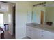 Bathroom featuring sink with storage and mirror at 328 Baytree Dr, Rotonda West, FL 33947