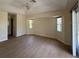 Bedroom featuring new wood floors, fan, and windows at 328 Baytree Dr, Rotonda West, FL 33947