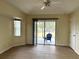 Bedroom with sliding glass door and fan at 328 Baytree Dr, Rotonda West, FL 33947