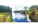 Serene canal view with lush tropical landscape at 328 Baytree Dr, Rotonda West, FL 33947