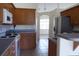Bright kitchen featuring wooden cabinets, stainless steel appliances, and tile flooring at 328 Baytree Dr, Rotonda West, FL 33947