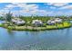 Home on an island surrounded by lush landscaping and beach views at 45 Seawatch Lake Dr, Boca Grande, FL 33921