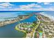 Wide aerial view of homes and beach community from the water at 45 Seawatch Lake Dr, Boca Grande, FL 33921