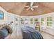 Bright bedroom with wood ceiling, large bay window, and white walls at 45 Seawatch Lake Dr, Boca Grande, FL 33921