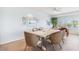 Beautifully decorated dining room with natural light, seating, and art at 45 Seawatch Lake Dr, Boca Grande, FL 33921