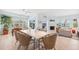Inviting dining room featuring a fireplace, with views and modern furnishings at 45 Seawatch Lake Dr, Boca Grande, FL 33921