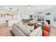 Bright living room featuring hardwood floors, a fireplace, and plenty of seating at 45 Seawatch Lake Dr, Boca Grande, FL 33921