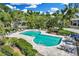 Beautiful community pool featuring lounge chairs and lush landscaping, perfect for relaxation at 45 Seawatch Lake Dr, Boca Grande, FL 33921