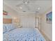 Comfortable bedroom boasts a ceiling fan, closet, and neutral color palette at 5000 Gasparilla Rd # 73A, Boca Grande, FL 33921