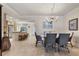 Elegant dining area with chandelier lighting and view of the kitchen at 5000 Gasparilla Rd # 73A, Boca Grande, FL 33921