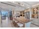 Spacious kitchen with an island breakfast bar, stainless steel appliances, and adjacent living area at 5000 Gasparilla Rd # 73A, Boca Grande, FL 33921