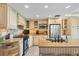 Well-equipped kitchen with stainless steel appliances, ample counter space, and custom cabinetry at 5000 Gasparilla Rd # 73A, Boca Grande, FL 33921
