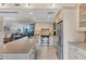 Spacious kitchen with updated appliances and breakfast bar that connects to the living room at 5000 Gasparilla Rd # 73A, Boca Grande, FL 33921