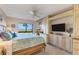 Beautiful main bedroom with beach view, custom built-ins, desk area, and ceiling fan at 5000 Gasparilla Rd # 73A, Boca Grande, FL 33921