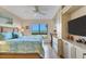 Inviting main bedroom featuring a beach view window, built-in storage, and a ceiling fan at 5000 Gasparilla Rd # 73A, Boca Grande, FL 33921