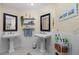 Elegant bathroom with double vanities and a clean design at 502 Pine Hollow Cir # 502, Englewood, FL 34223