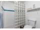 Clean bathroom with glass block shower and a pedestal sink at 502 Pine Hollow Cir # 502, Englewood, FL 34223