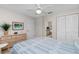 Bright bedroom with dresser, mirror and double closet at 502 Pine Hollow Cir # 502, Englewood, FL 34223