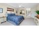 Well-lit bedroom featuring a comfortable bed and built-in shelving at 502 Pine Hollow Cir # 502, Englewood, FL 34223