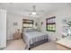 Bedroom with a double bed, ceiling fan, and ample closet space at 502 Pine Hollow Cir # 502, Englewood, FL 34223