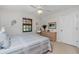 Bedroom with double bed and dresser with plenty of natural light at 502 Pine Hollow Cir # 502, Englewood, FL 34223