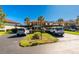 Two-story condo building with parking and lush landscaping at 502 Pine Hollow Cir # 502, Englewood, FL 34223