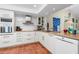 Modern kitchen with white cabinets, wood countertop and stainless steel appliances at 502 Pine Hollow Cir # 502, Englewood, FL 34223