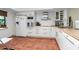 Modern kitchen with white cabinets, wood countertop and appliances at 502 Pine Hollow Cir # 502, Englewood, FL 34223