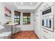 Modern kitchen with white cabinets, wood countertop and breakfast nook at 502 Pine Hollow Cir # 502, Englewood, FL 34223
