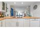 Modern kitchen with wood countertops and stainless steel appliances at 502 Pine Hollow Cir # 502, Englewood, FL 34223