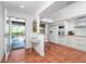 Modern kitchen with white cabinets and terracotta tile floor at 502 Pine Hollow Cir # 502, Englewood, FL 34223