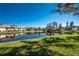 Tranquil pond view of a condo community at 502 Pine Hollow Cir # 502, Englewood, FL 34223