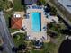 Community pool with surrounding lounge chairs at 502 Pine Hollow Cir # 502, Englewood, FL 34223